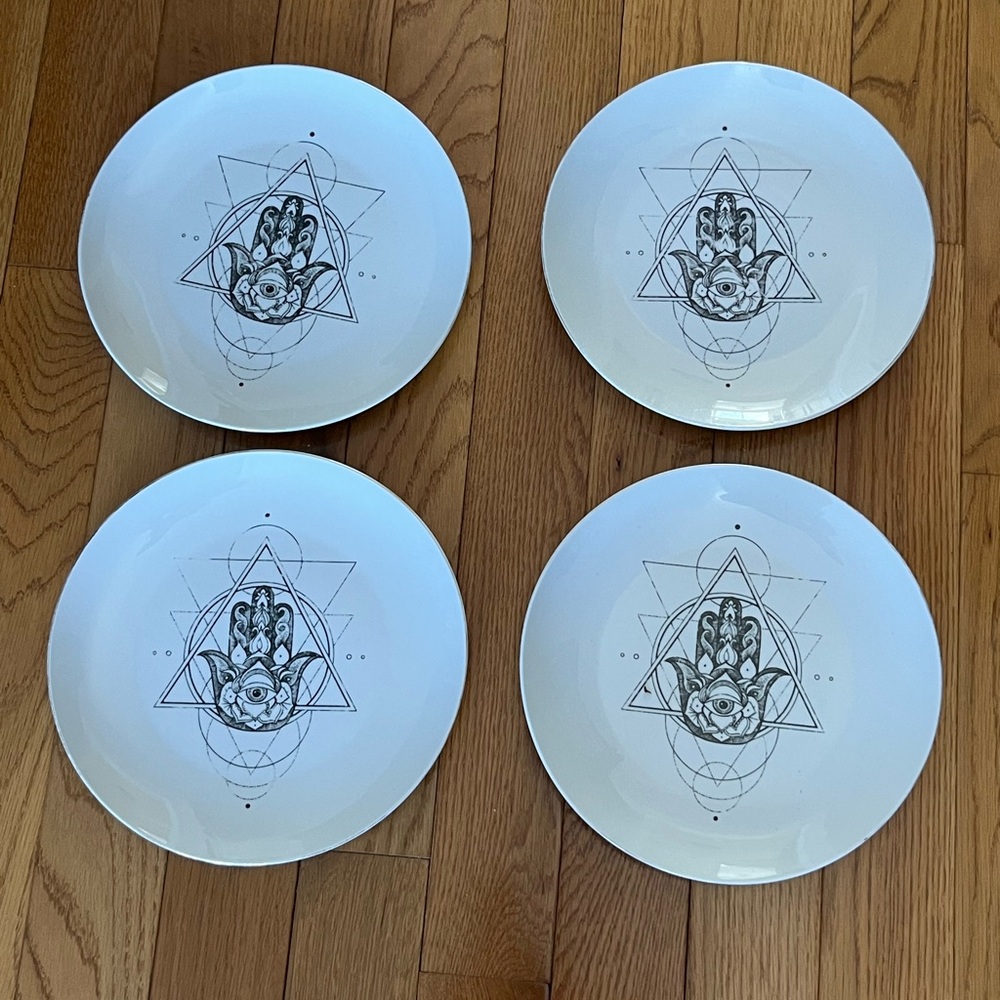 set of four Harvest Green Studio Halloween Hamsa Hand dinner plates.